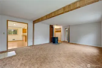 Spacious living room wraps from kitchen and dinning room on one end to main bedroom.