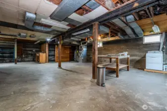 The unfinished basement offers an additional 1135 SF of POSSIBILITY!!! Here you'll find the washer and dryer, a large table for folding laundry or other projects, utility sink and a separate storage room. The natural gas furnace and water heater are located here as well. Windows on all sides of the Basement keep this space light all day long.
