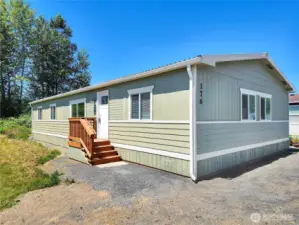 Fresh exterior paint, new porches, and updated skirting welcome you home.