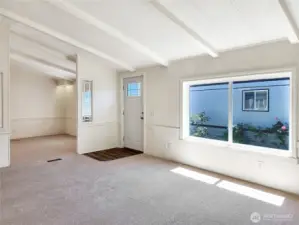 Bright and inviting living space with fresh neutral paint and plush high-end carpet.