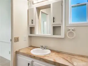 Room to Refresh. The primary bath features ample counter space—perfect for daily routines and extra storage.