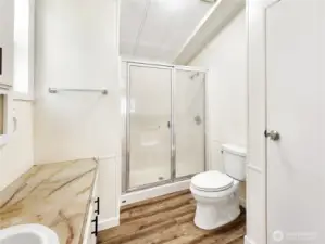 Primary Suite Perk: The attached 3/4 bath offers a generous shower and a clean, updated look.