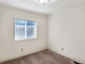 Just Right Lighting. Blinds in the bedroom provide flexible light control and added privacy.