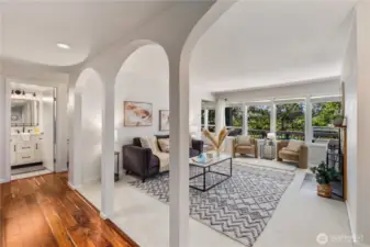 Spacious entry and living room with new carpet and fresh paint throughout