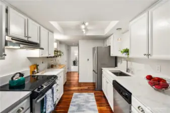 Remodeled kitchen with newer appliances, fixtures and deep sink