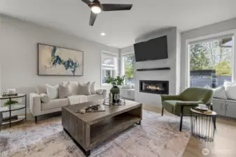 Bright and spacious living room with fireplace – mounted TV stays!