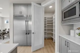 True walk-in pantry with built-in shelves for optimal organization.
