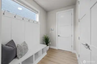 Mudroom with storage closet and garage access – perfect drop zone.