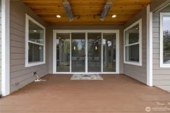 Covered patio with built-in ceiling heater for year-round enjoyment.