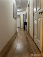 Hallway to garage, bedrooms and bathrooms