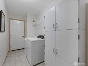 Washer and dryer and entrance to garage