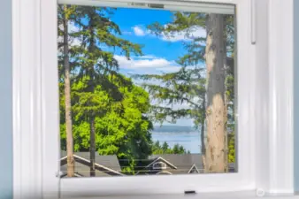 This water view is peek-a-boo framed by the window in Bedroom 2