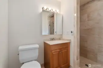 Primary bath with walk in shower and heated floors.