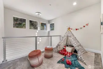 Upstairs landing makes a great playroom, but can also be an office or workout room