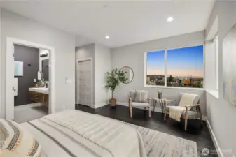 Luxe primary suite with two walk-in closets