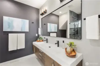 Primary bathroom with dual vanity, heated bathroom floors, and a large two piece rain shower
