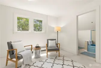 A large, bright landing space is lit by overhead light and windows facing south. This is a space for an additional sitting room, exercise spot, or maybe a play area. With the bathroom at one end, and the front bedroom at the other, it could also be reimagined/reconfigured to create a primary suite.