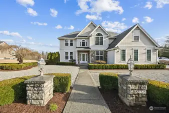 Stunning 2 story landscaped front yard with Esthetically pleasing side entrance garage