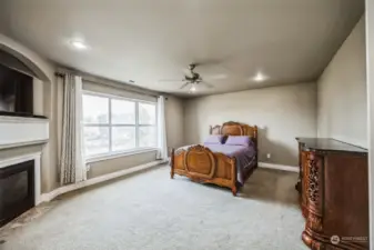 Upstairs primary bedroom with gas fire place