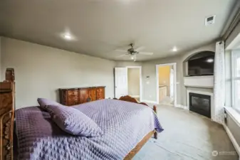 Upstairs primary bedroom with gas fire place