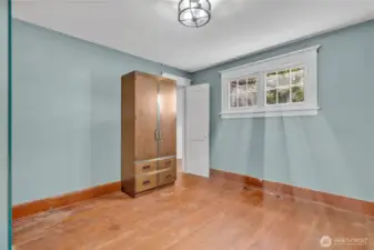 Upstiars bedroom with back walk in storage space.