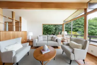 Wall of windows allows sunlight to flow in.