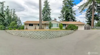 Drive to the right goes to the front door- to the left goes to the detached garage.