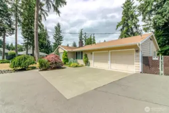 This attached garage was converted to another bedroom, a half bath, a laundry room and plenty of storage. The front of it is for a shop plus motorcycle parking- and could accommodate a small car