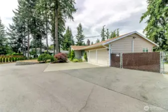 Lots of parking for either large gatherings - or space to add another garage if needed.