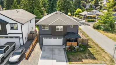 Corner lot with ample off street parking in driveway & gravel pad.