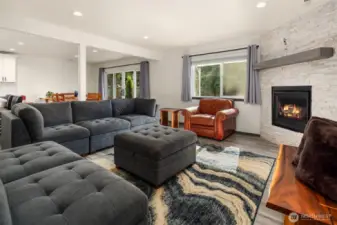 Open concept living space with seamless flow between living room, dining room & kitchen.