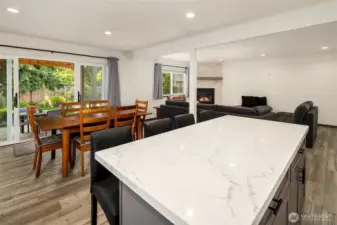 Kitchen looking into living space with island seating.