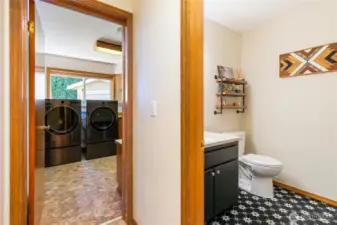 1/2 bath in the hallway leads to laundry room