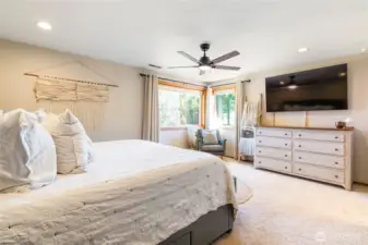 Primary bedroom, looks to the back yard and view of Mt Baker