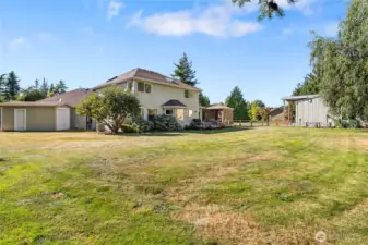 Lawn shed to the left and large back yard.