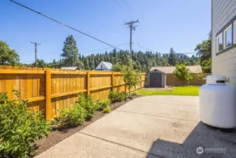 Additional paved parking inside of fenced yard