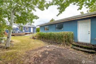 House and garage sit on a large lot