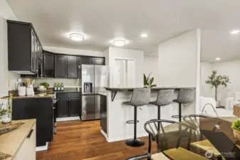 Kitchen with eating bar and granite counters