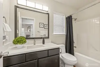 Upstairs bathroom with new sink, faucet, mirror, lighting and quartz counters