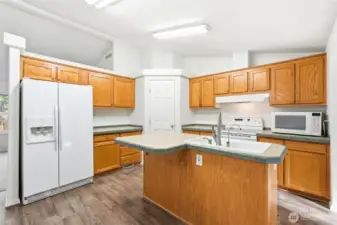 With a spacious island, walk-in pantry, and open flow to both living areas and the dining room, this kitchen is ideal for gatherings and everyday life.