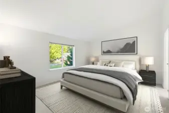 Private primary suite with ensuite and large walk-in closet.