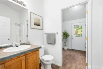 The full bathroom, conveniently connected to the utility room, features a full tub/shower combo and fresh paint and flooring throughout.