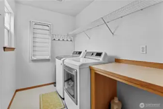 Large Laundry room with shelving