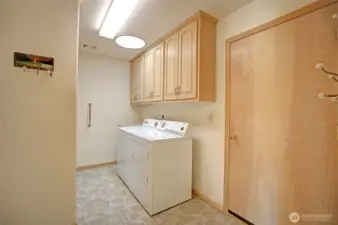 Laundry room and half bath is just off the kitchen leading to the garage.