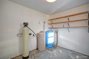 Private well with a water softening system.