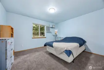 Large bedroom to the left of the bathroom