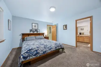 expansive primary bedroom with en suite