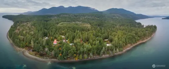 Wonderful, treed acreage. Just a short distance from the Hood Canal. Pt Whitney boat launch and beach is shown to the left.
