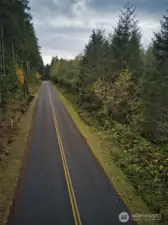No homes in site. This view is to the North with the property on the left side of the road.