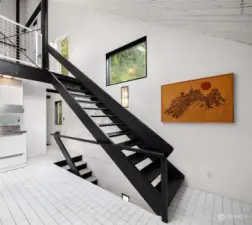 Floating staircase with minimalist railing.